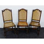 A set of three oak chairs, with carved top rails and cane backs and seats, 106 x 48cm, (3)