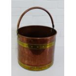 A copper and brass circular bucket