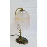 An Art Nouveau style table lamp with opaque pink glass shade, 37cm high