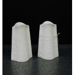 A pair of Kaiser white glazed floral moulded miniature vases, 11cm high, (2)