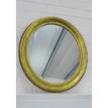 An oval gilt framed wall mirror, 62 x 55cm