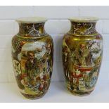 A pair of Japanese earthenware baluster vases painted with figures, butterflies, flowers and