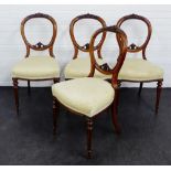 A set of four mahogany balloon back chairs, with carved top rails and upholstered padded seats, 92 x