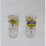 A pair of tapering beaker shaped glass vases painted in coloured enamels with basket of flower
