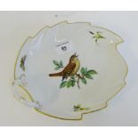 A Meissen leaf shaped dish painted with a bird, butterfly and flowers, with blue cross swords mark