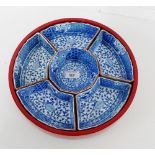 A modern blue and white porcelain Hors D'oeurves set on circular lacquered tray, 34cm diameter