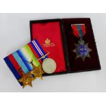 WWII medals to include the 1939 - 1945 Star, Atlantic Star and War medal together with an Edward VII