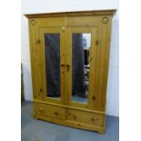 A modern pine wardrobe with two mirrored doors and pair of drawers tot he base, , 200 x 148cm