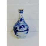 A Chinese blue and white garlic-neck vase painted with a village landscape scene, 24cm high