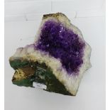 A large Amethyst crystal, 34cm wide