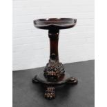 An Edwards & Roberts mahogany stool, the solid seat on dolphin column and circular base with three