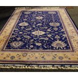 A Royal Keshan handmade carpet, the blue field with allover foliate design within a flowerhead