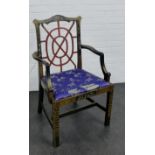 A chinoiserie gilt decorated open armchair, the shaped top rail over a circular red lattice back and