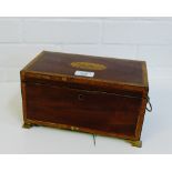 A mahogany and inlaid box with brass lion mask handles to side and four ogee brass feet, 26 x 14cm