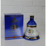 A Bell's Extra Special Old Scotch Whisky decanter and contents commemorating 100 Years of Queen