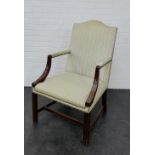 A mahogany framed open armchair with upholstered back, arms and seat