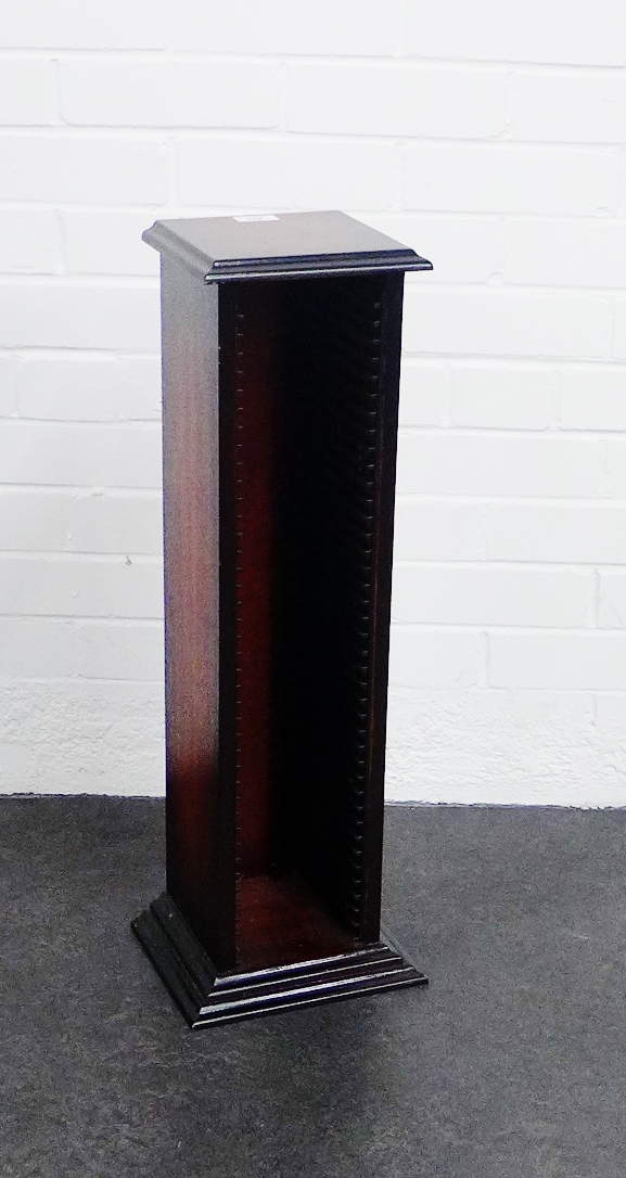 A stained wood CD tower, 72cm high