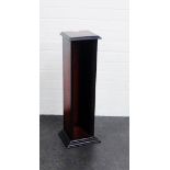 A stained wood CD tower, 72cm high