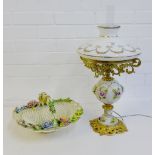 A floral encrusted porcelain lamp with opaque glass shade together with a floral encrusted
