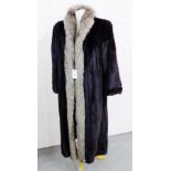 A Mink full length coat with silver fox fur trim with a Dominion Fur Company label to the silk