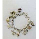 Silver charm bracelet with heart padlock