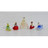 A collection of four Royal Doulton miniature porcelain figures to include 'Elaine', 'Festive