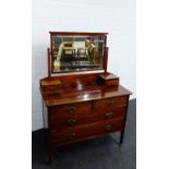 A mahogany dressing table with pair short pedestal drawers over two short and two long drawers,