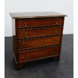 An oak chest of drawers, the rectangular top above four long drawers on bracket feet, 92 x 92cm