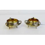 A pair of Edwardian silver gilt Arts & Crafts salts with makers mark for Charles Edwards, London