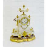 A white hardstone and ormolu mantle clock, the arched top surmounted by a twin handled urn with