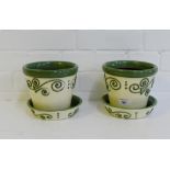 A pair of C.H Brannam, cream glazed planters with green rims and trailing pattern complete with