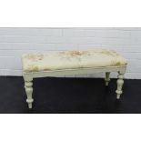 A white painted window stool with floral upholstered seat and turned baluster supports, 40 x 88cm