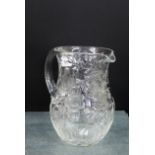 Clear glass water jug with finely cut floral decoration, 18cm high