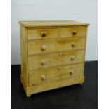 A pine chest of drawers, two short drawers over three graduating drawers on bun feet, 165 x 100cm