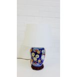 A contemporary Chinoiserie ceramic table lamp and base