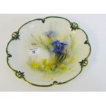 A Hadley's, Worcester porcelain cabinet plate painted with Thistles, with a green and gilded