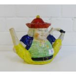 A teapot modelled as a man in yellow breeches, 20cm high