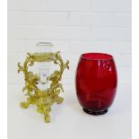 A gilt wood stand with a glass vase, together with a red glass vase, (2)