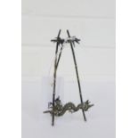 A Chinese white metal bamboo and dragon photograph stand, 15cm high