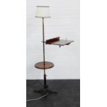 An adjustable standard lamp with sloped reading shelf and cast metal base, 166 cm high From the