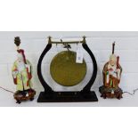 A mixed lot to include two Chinese figural table lamps together with a brass table gong, (3)