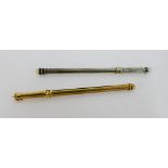 9 carat gold engine turned swizzle stick together with a Sterling silver swizzle stick (2)