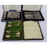 Two cased sets of six silver handled butter knives together with a cased set of six Glasgow silver