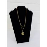 9 carat gold Taurus circular pendant on a 9 carat gold chain together with a 9 carat gold box