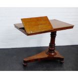 A 19th century mahogany reading desk with baluster column and bun feet, 74 x 92cm From the