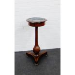 A 19th century mahogany pedestal jardiniere raised on an octagonal baluster support , with lead