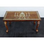 An Indian hardwood and inlaid table the rectangular top depicting the Taj Mahal, 46 x 92cm