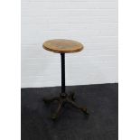 A burr wood circular topped side table with cast metal base, 66cm high From the residual contents of