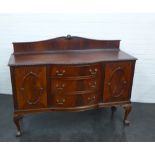 A mahogany ledgeback sideboard on cabriole supports, 117 x 153cm