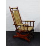 An American rocking chair with upholstered back, seat and arms, 98 x 56cm